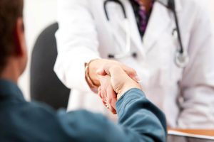 consultation begins with shaking hands with dentist