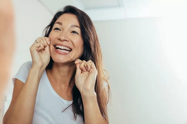 woman flossing