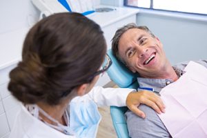 older man on the dental chair ready for dental treatment